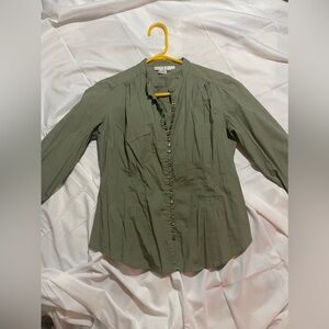 Green long sleeve buttoned down shirt, causal wear.